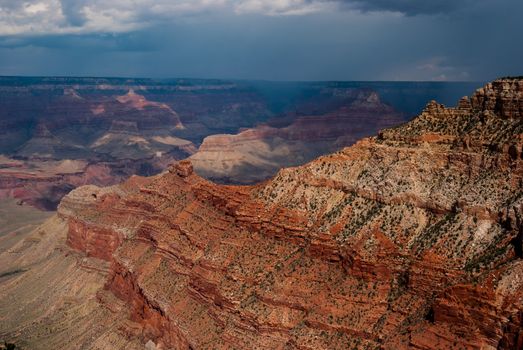 Photograph of a storm enveloping the North rim of the Grand Canyon.