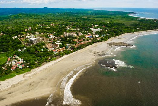 Photograph of a Costa Rican Resort town taken from the air.  Resort located on the Pacific Ocean.