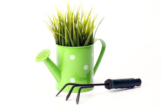  gardening tools and grass on white background 