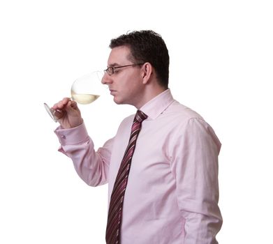 Portrait of a man with tie smelling a glass of white wine