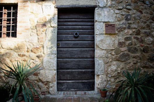 Wooden door at the ancient Tuscany Castle