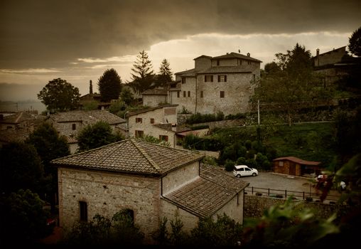 Small Italian village with ancient bricked house and tower