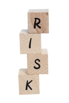 Risk tower spelt with uneaven wooden blocks.