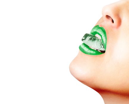 Closeup of sensual lips with green lipstick and an ice cube