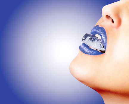 Closeup of sensual lips with blue lipstick and an ice cube