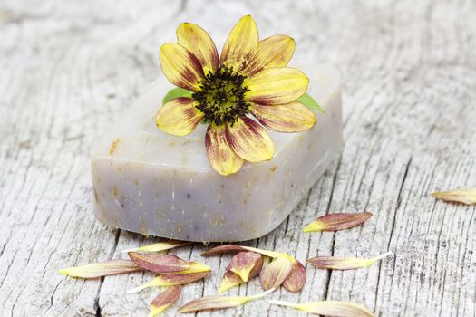 bar of natural soap and flower