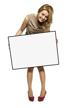 Attractive Young Woman Holding Up a Blank Sign. Studio shot of woman isolated on white background.