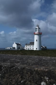 Lighthouse and sky on the irish coast
