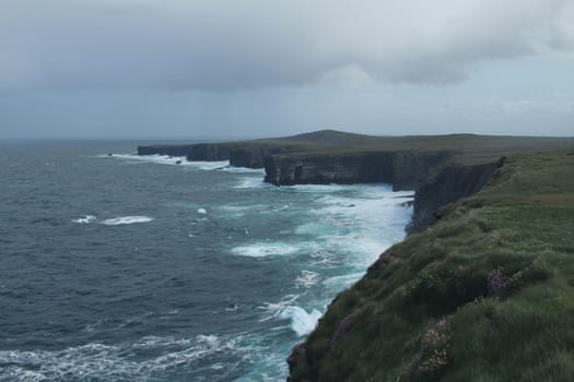 Cliffs and grassy hillside, Ireland 
