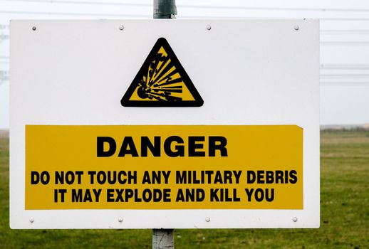 Danger sign warning that touching may kill you