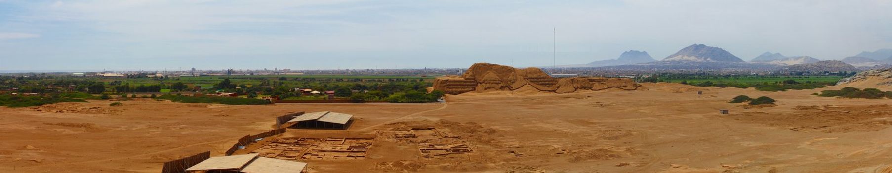 Panoramic photo of Huaca del Sol and archaeological excavations. This photo is made attaching together various photos
