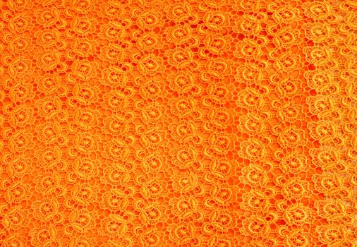 Detail of orange lace pattern fabric 
