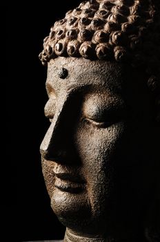 Buddha head isolated on black