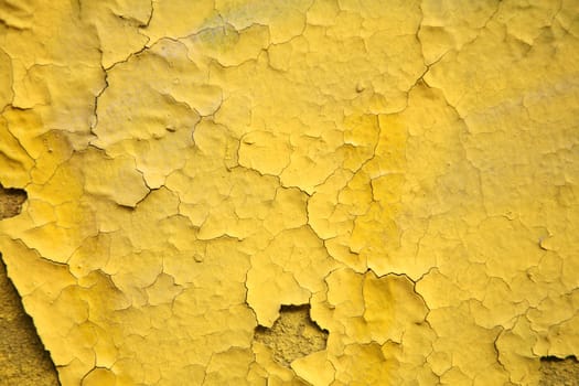 old wall of a house  yellow surface in bad condition

