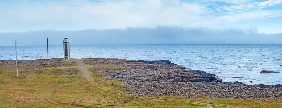 North Iceland Sea Landscape with Lighthouse and clouds Sky. Panorama