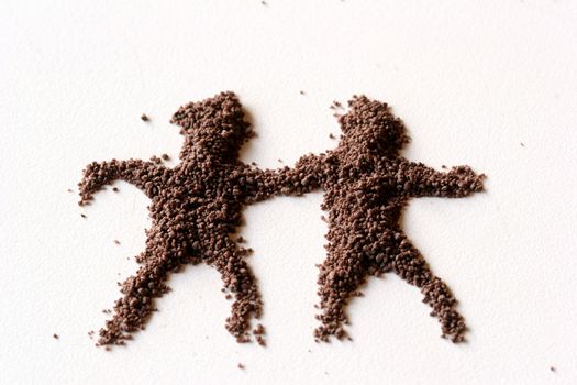 small  figures of man made in chocolate powder