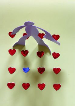 small rudimentary figures of man in paper