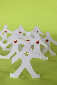 small rudimentary figures of man in paper