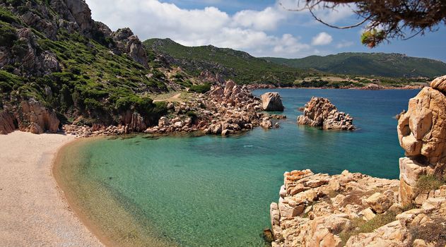 Typical clear water and red rocks of Costa Paradiso or Paradise Beach on the island of Sardinia, Italy.