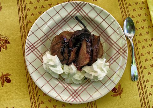 Baked pear with cherry jam and whipped cream - Provence, France.