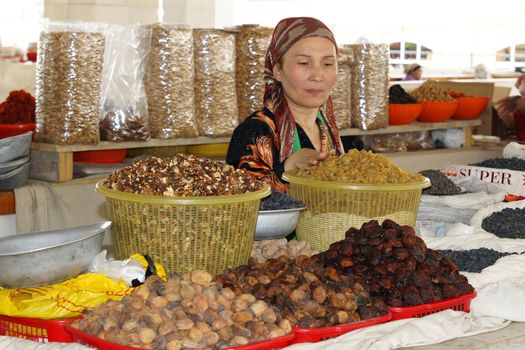 Woman trading on a food market. Photo was taken in Samarkand, Uzbekistan
