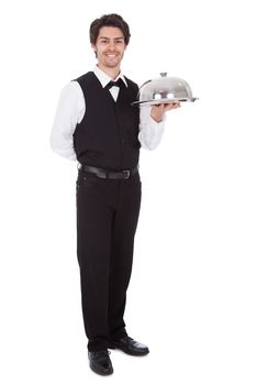 Portrait of a butler with bow tie and tray. Isolated on white