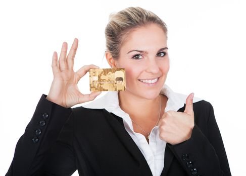 Businesswoman holding credit card. Isolated on white