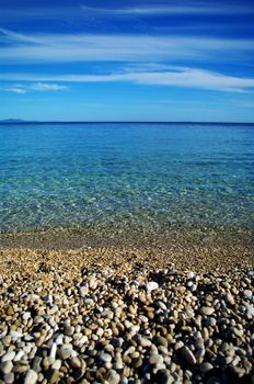 Pebbles beach and cristal clear sea