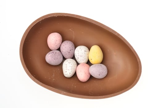 Group of small eggs in chocolate shell