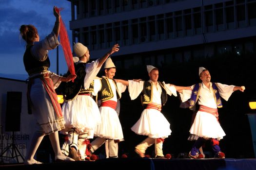 folk dance on stage from balkans in a festival