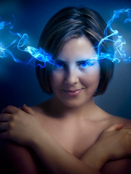 Beautiful young woman with blue eyes, blue smoke coming out of his eyes