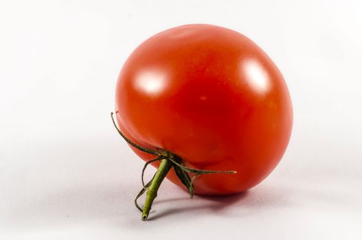 red Tomato isolated on white background.