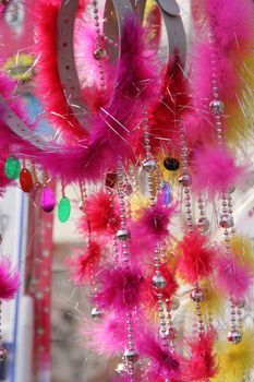 Feathers, beads and bangles head bands for Chinese Lunar New Year sold at temple fair in Beijing China