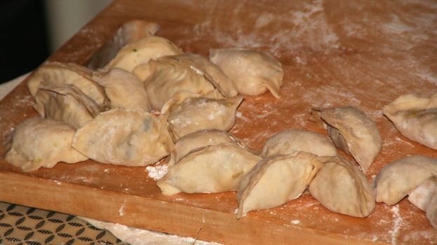 Chinese Lunar New Year Dumplings.  It is traditional in China to eat Chinese dumplings on New Year's Eve because the dumplings are in the shape of money in old China.