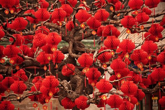 Lucky Red Lanterns Chinese New Year Decorations Ditan Park Beijing China.  During Lunar New Year, many parks and temples in China have large outdoor fairs, festivals.  Chinese characters on lanterns say lucky and long life.