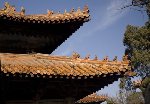 Roofs Confucius Temple, Qufu, Shandong Province, China  The figures on top of the temple are called in Chinese No Way Out.  The figure at the end resembles Confucius.