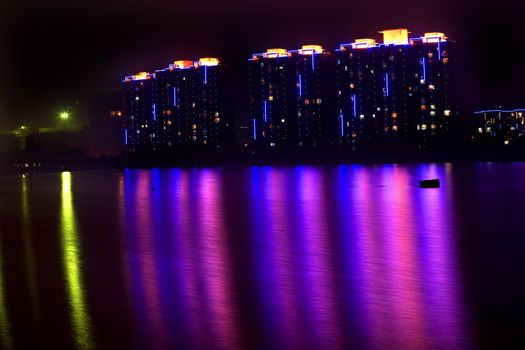 Apartments at Night Hun River Fushun, Shenyang, Liaoning Province, China Trademarks removed.

Resubmit--In response to comments from reviewer have further processed image to reduce noise, sharpen focuse and adjust lighting.

