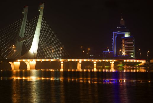 Tianhu Bridge, Hun River, Fushun, Shenyang, Liaoning Province, China Night Lights Rural Electricity Trademarks removed

Resubmit--In response to comments from reviewer have further processed image to reduce noise, sharpen focuse and adjust lighting.
