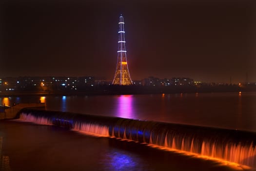 Electricity in Rural China, Radio Tower, waterfal at night with lightsl, Fushun City, Liaoning Province, China

Resubmit--In response to comments from reviewer have further processed image to reduce noise, sharpen focuse and adjust lighting.
