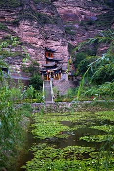 Binglin Si Bright Spirit Buddhist Temple Water Liliies Garden Cliff Lanzhou Gansu China

Resubmit--In response to comments from reviewer have further processed image to reduce noise, sharpen focus and adjust lighting.