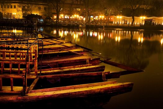 Wooden Boats, Houhai Bacl Lake, Beijing, China  Houhai Lake is in the back of Beihai Lake in Beijing.  It used to be the swimming hole in Beijing and now is surrounded by restaurants and bars, which makes it a beautiful place at night.