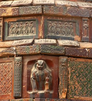 Ancient Crouching Tiger Dancer Bricks Buddhas Dancers Chinese Officials Iron Pagoda Buddhist Monument Kaifeng China Built in 1069 by the Kaibao Buddhist Monstary.  Best example of glazed brick pagoda in China