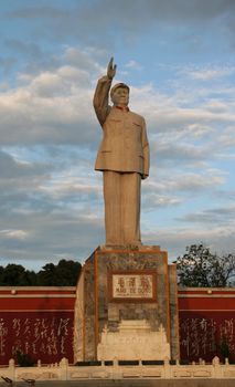 Statue of Mao Tse Tung, Lijiang, Yunnan Province, China.  During the 60s-80s Mao statues were in every town and city in China and became a symbol of the Cultural Revolution.  Now few statues are left.  This is one of them.