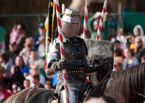 Armored rider with lance on horse