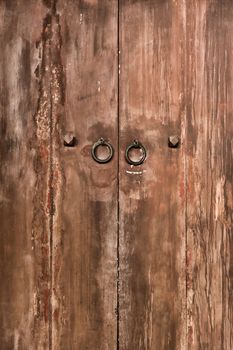 Old door of wooden was closed with grungy style.