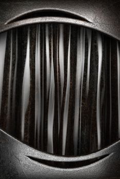 Metal on black silk curtain