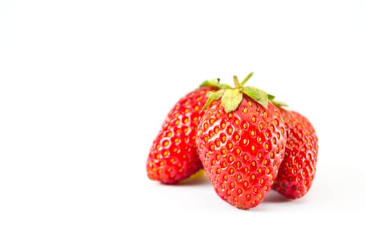 strawberries placed on a white background