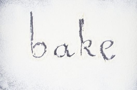 Inscription made by hand by sprinkled flour on a oven-tray