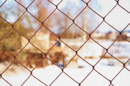 rusty metal mesh fencing close up private property