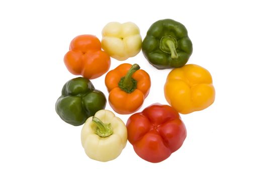 Paprika pieces in five different colors isolated on white background